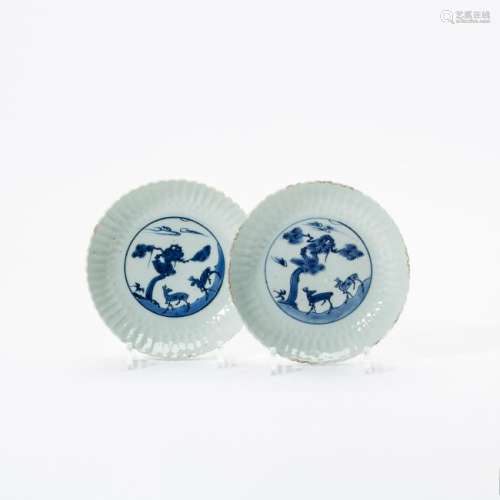 A pair of Chinese blue and white moulded 'deer' plates