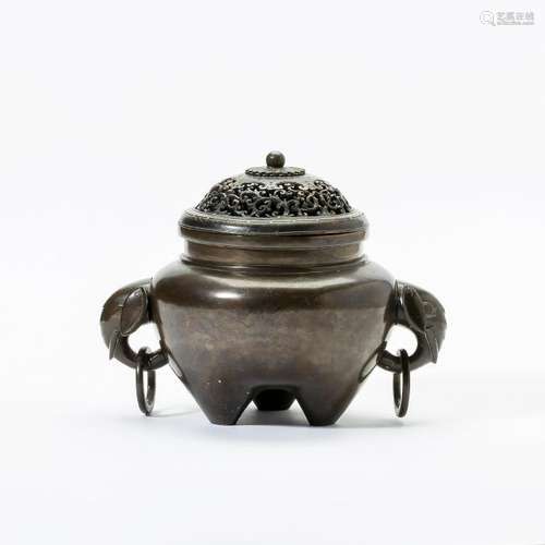 A Chinese bronze tripod censer