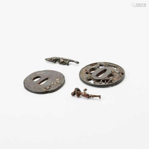 Two Japanese iron tsuba and two metal clasps