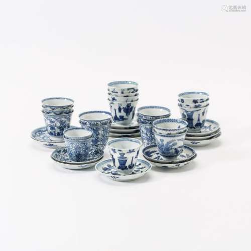 A collection of Chinese blue and white cups and saucers