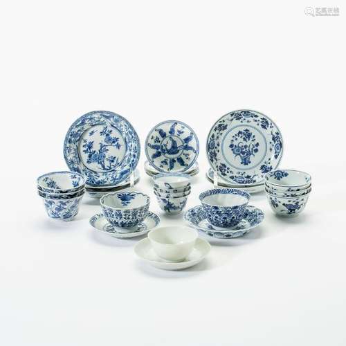 A collection of Chinese blue and white cups and saucers