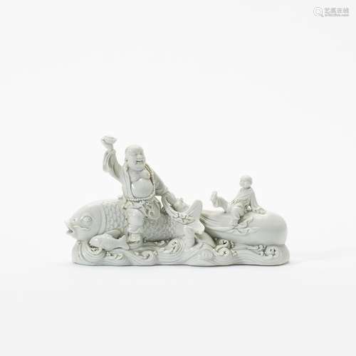 A Chinese blanc-de-chine sculpture of Budai riding a