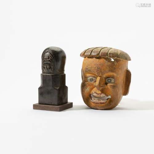 A Nepalese wooden mask and a Cambodian bronze lingam