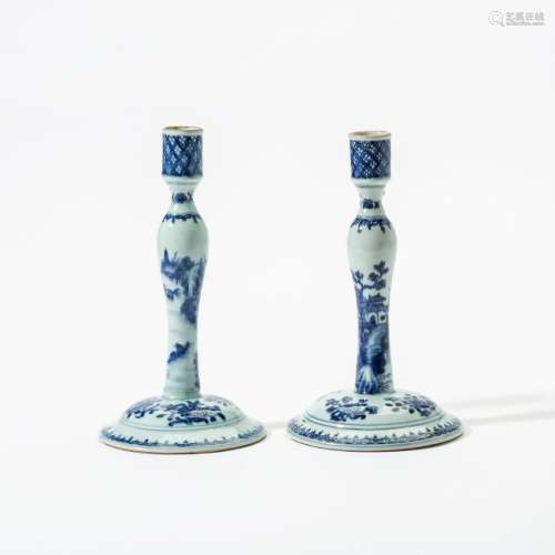 A pair of Chinese export blue and white candlesticks