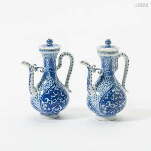 A pair of Chinese blue and white ewers and covers