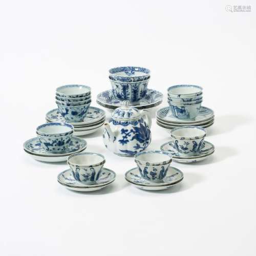A collection of Chinese blue and white cups and saucers