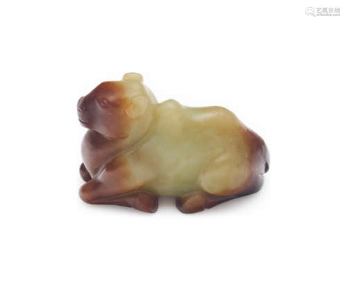 A yellow jade figure of a kneeling cow