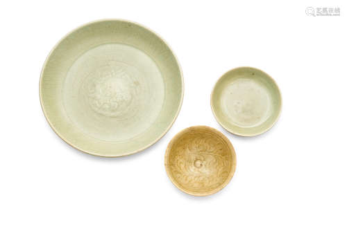 14th/15th century Two longquan celadon moulded floral dishes and a celadon carved bowl