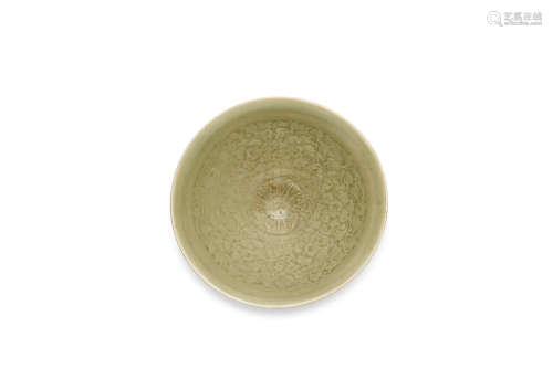 12th/13th century A Yaozhou moulded celadon glazed 'floral' conical bowl