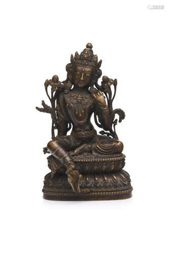 A bronze seated figure of a Green Tara