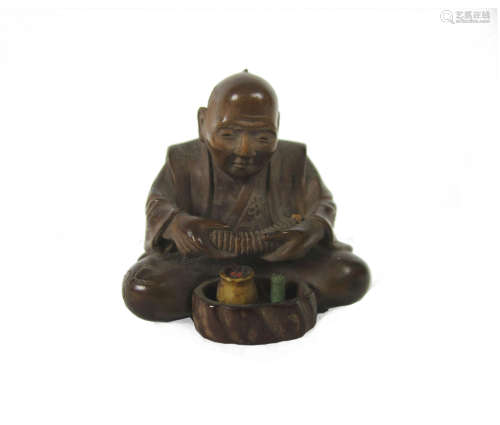 By Sokoku, born 1920 A carved wood netsuke