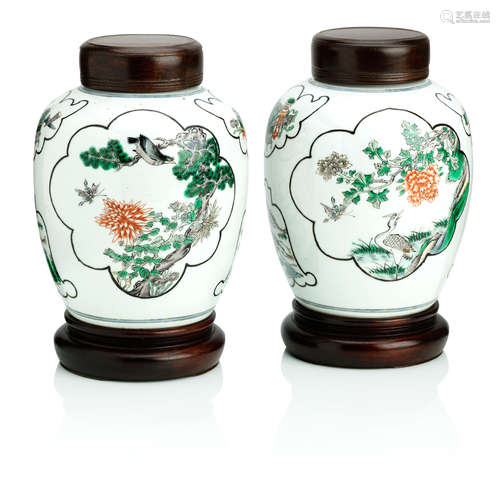 19th century A pair of famille verte jars with wood covers and stands