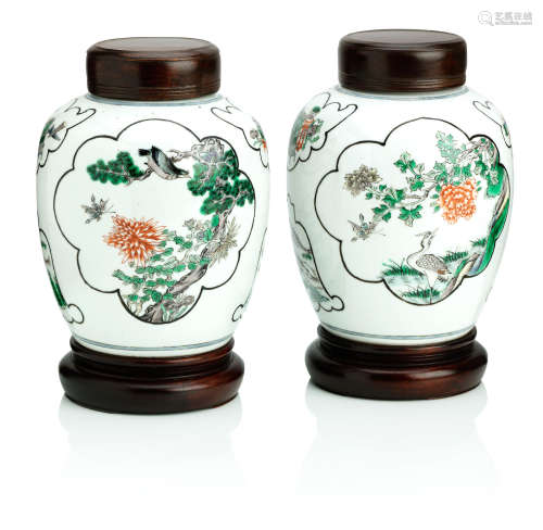 19th century A pair of famille verte jars with wood covers and stands