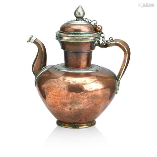 Tibet, 19th century A ceremonial copper ewer and cover with silvered-metal mounts