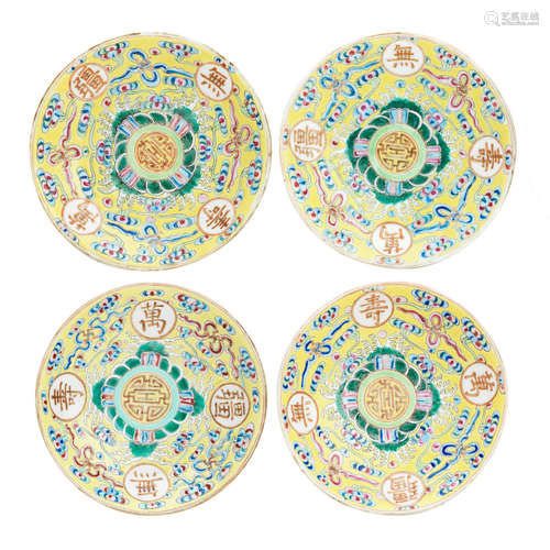 Guangxu six character marks in iron red A set of four yellow-ground porcelain 'birthday' saucer dishes