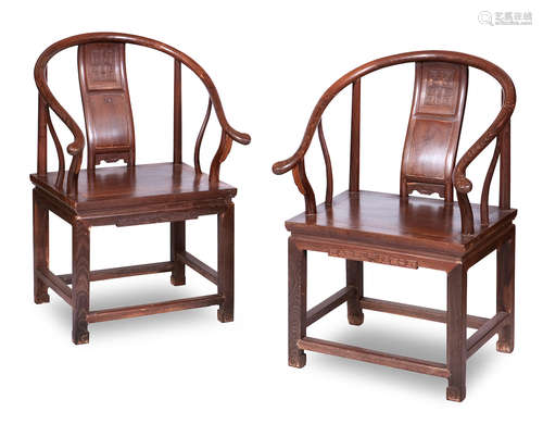 20th century A pair of hardwood horseshoe back armchairs, quanyi