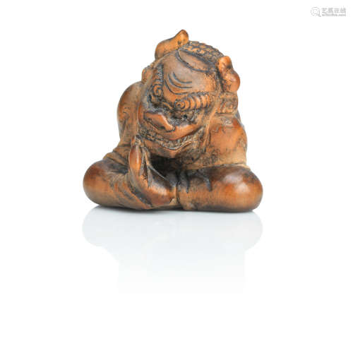 Mid-19th century A wooden netsuke of a shishimai performer