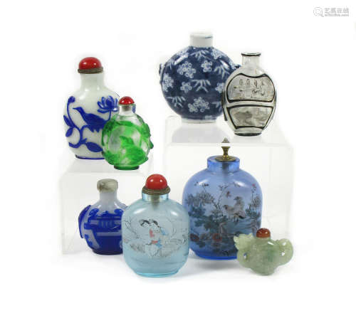 A collection of various snuff bottles