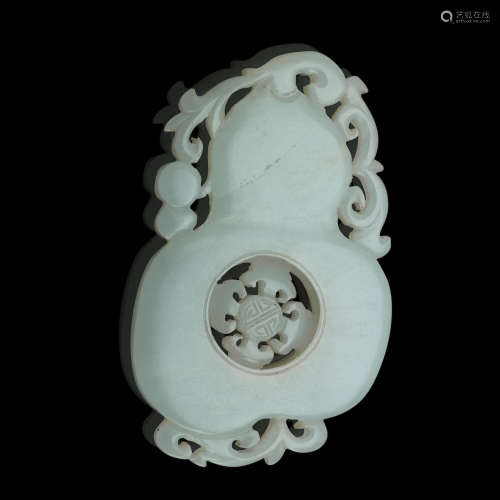 Circa 1900  A carved jade articulated pendant