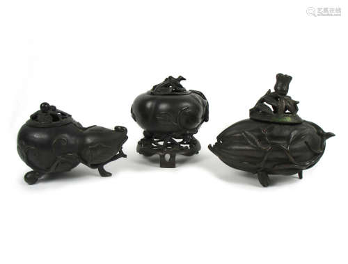 Three fruit-form bronze incense burners with pierced covers