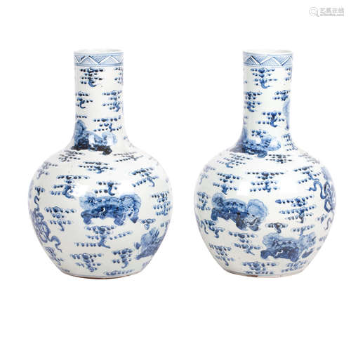 A pair of large blue and white bottle vases