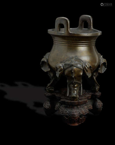 Well defined Xuande six-character mark but 19th century A large and impressive bronze tripod incense burner on wood stand