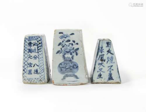 Three blue and white joss stick holders/scroll weights