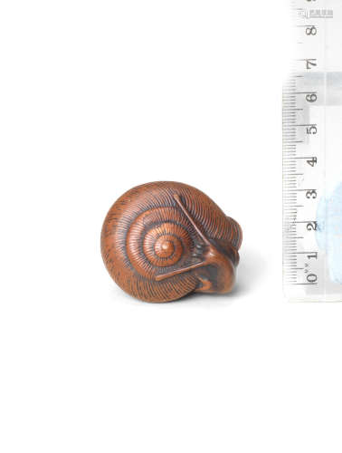By Masayoshi, Nagoya, Edo period (1615-1868), 19th century A wood netsuke of a snail