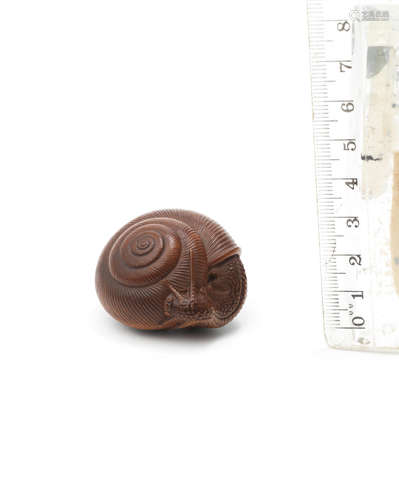 By Naito Toyomasa (1773-1856), Tanba Province, Edo period (1615-1868), early-mid 19th century A fine wood netsuke of a snail