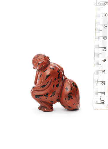 Edo period (1615-1868), 18th century A  lacquered wood netsuke of a monkey