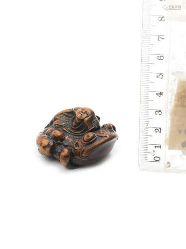 By Shuya, Edo period (1615-1868), early-mid 19th century A wood netsuke of Gama sennin on a frog