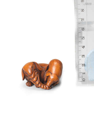 Edo period (1615-1868), early 19th century A rare boxwood netsuke of a baku and young