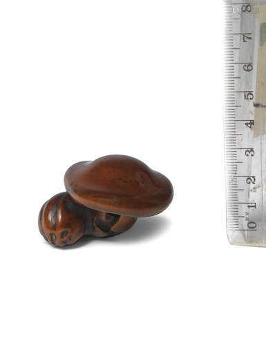 By Ishiyama, Edo period (1615-1868), early-mid 19th century A wood netsuke of a mushroom