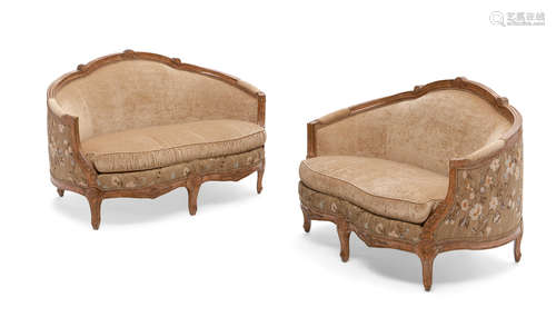 A pair of Rococo style faux grained upholstered sofas