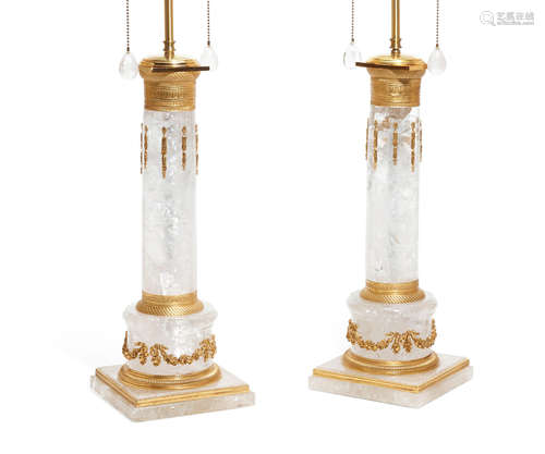 A pair of Empire style gilt bronze mounted rock crystal columnar table lamps