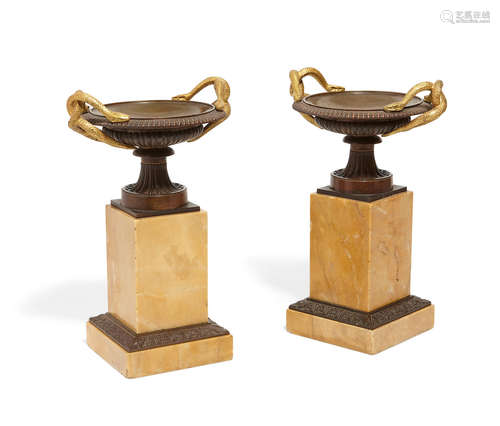 Late 19th century A pair of Empire style patinated gilt bronze and sienna marble pedestal urns