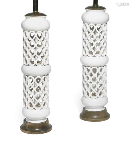 A pair of white glazed and pierced ceramic lamps