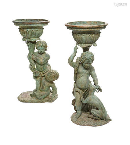 A pair of patinated bronze figural jardinières