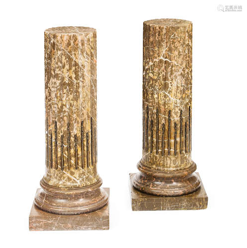 A pair of Neoclassical style bronze stop fluted marble pedestals