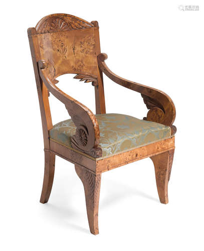 First quarter 19th century A Russian Neoclassical carved karelian birch armchair