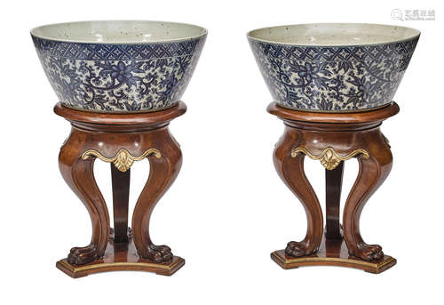 A pair of Chinese blue and white porcelain jardinéres on hardwood stands