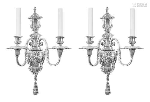 A pair of Baroque style silvered metal two light wall sconces after a model by E. F. Caldwell & Co., New York, NY