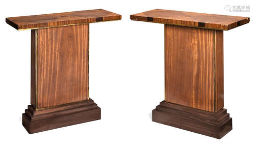 A pair of Chester Jones brass mounted satinwood and walnut console tables