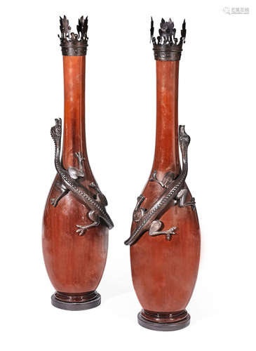 A pair of cast iron mounted brown ceramic floor vases