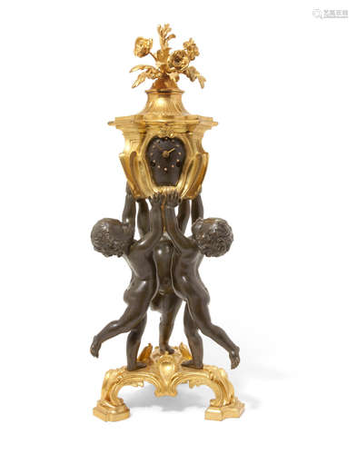 Late 19th century A French patinated and gilt bronze figural mantel clock