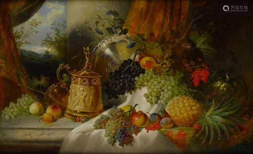 A still life with an array of fruit, flowers, a jeweled tankard and a silver plateau on a draped marble ledge 29 x 46in (74 x 117cm) Manner of Jan van Huysum