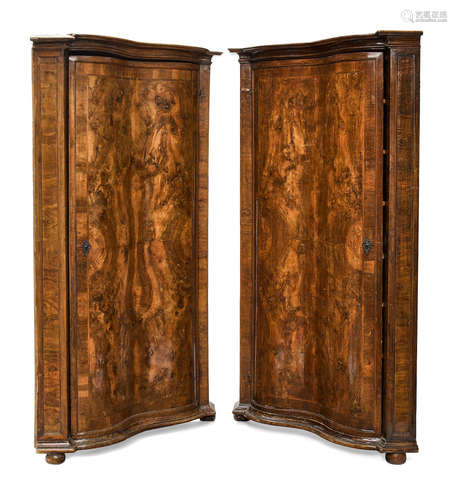 18th century A pair of Continental Baroque walnut corner cupboards