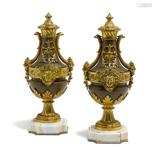 Late 19th century A pair of Louis XVI style gilt bronze mounted patinated metal and marble urns