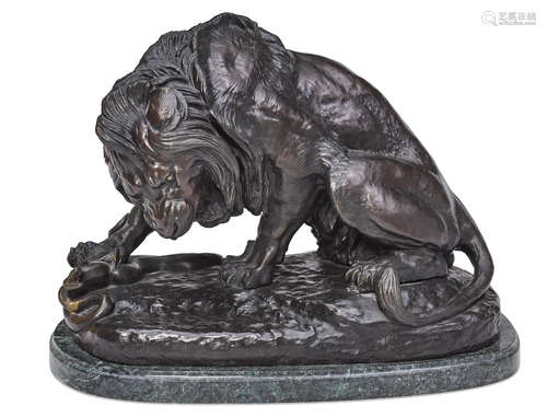 20th century A patinated bronze model of a lion and serpent