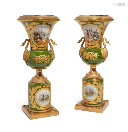 First quarter 20th century A pair of Sèvres style porcelain and gilt bronze mounted two handled urns